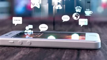 Smartphone with digital icons floating above the screen.