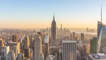 New York City skyline with the Empire State Building at sunrise.