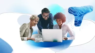 Three people looking at a laptop