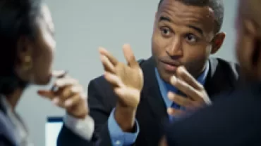 Business meeting with people discussing.