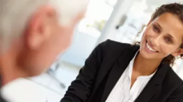 Businesswoman smiling in a meeting