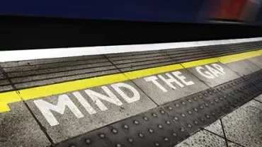Platform edge with 'Mind the Gap' warning.