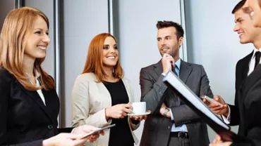 Business people having a discussion in a bright office.