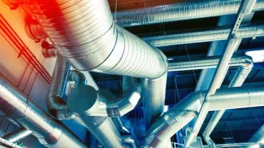 Industrial ductwork in a building ceiling.