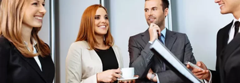 Business people having a discussion in a bright office.