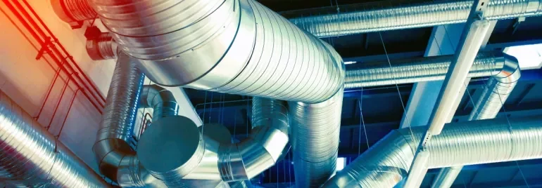 Industrial ductwork in a building ceiling.