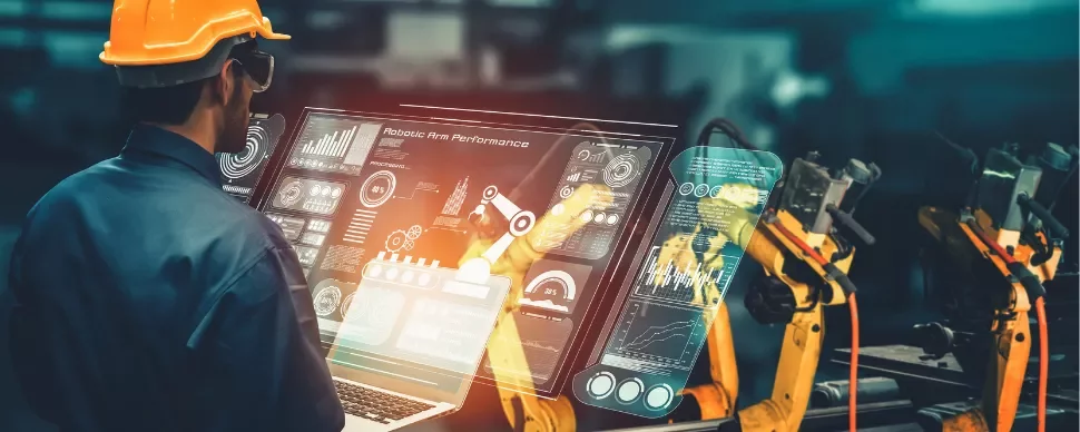Ingénieur analyse la performance d'un bras robotique sur écran numérique.