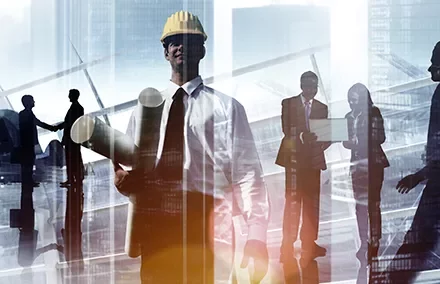Group of business and construction professionals collaborating in a city setting.