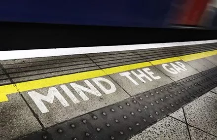 Platform edge with 'Mind the Gap' warning.