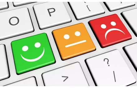 Keyboard with smiley, neutral, and sad face keys.