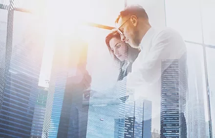 Business people working with cityscape overlay.
